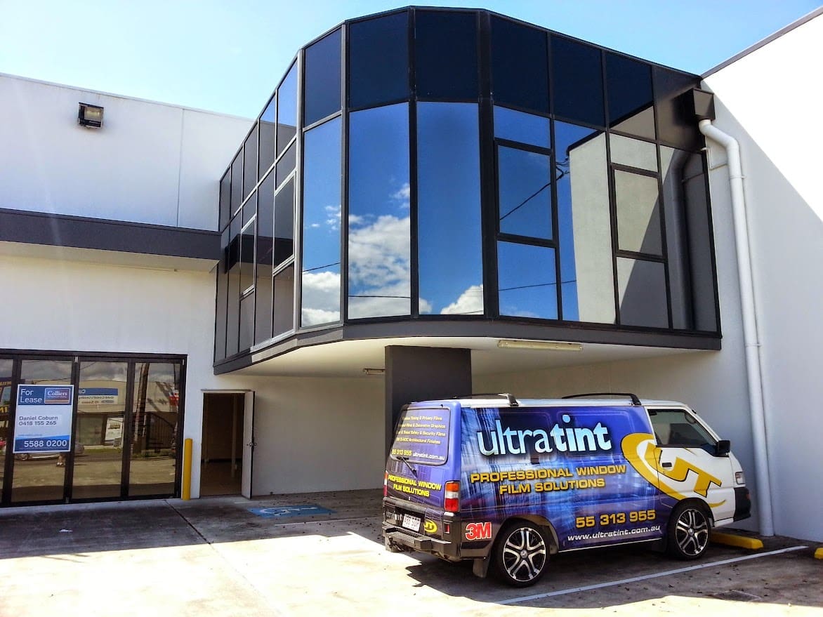 Commercial glass protected with anti-graffiti film.